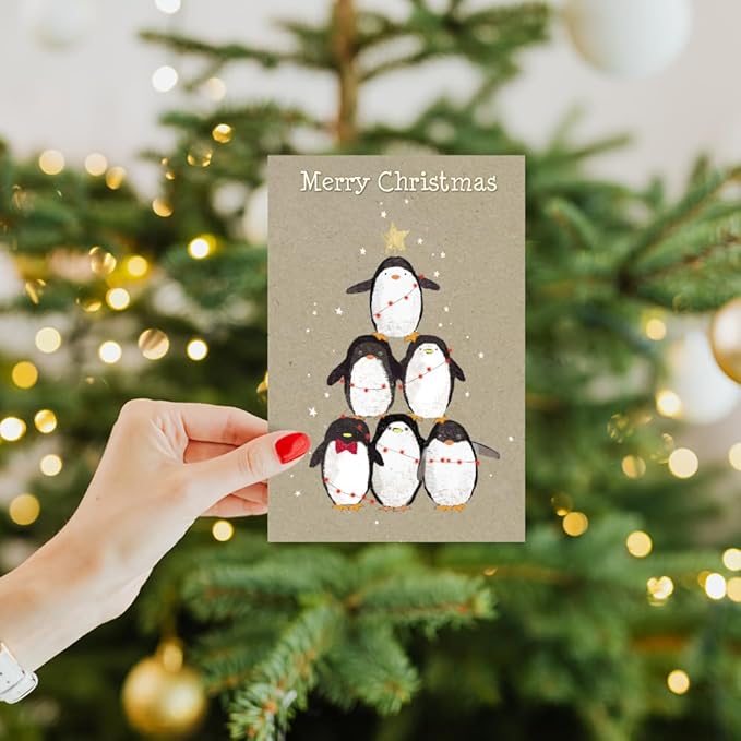 Tree-Free Greetings - Season's Greeting Card - Artful Designs - 1 Card + Matching Envelopes - Made in USA - 100% Recycled Paper - 5"x7" - Penguin Pile (FS93532)